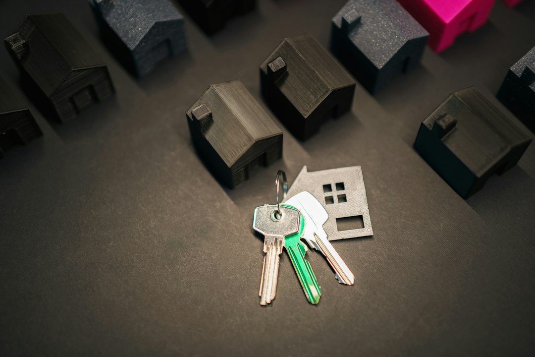 Close-up of a person's hand inserting a sleek, modern key into the lock of a front door, symbolizing unlocking a new busin...